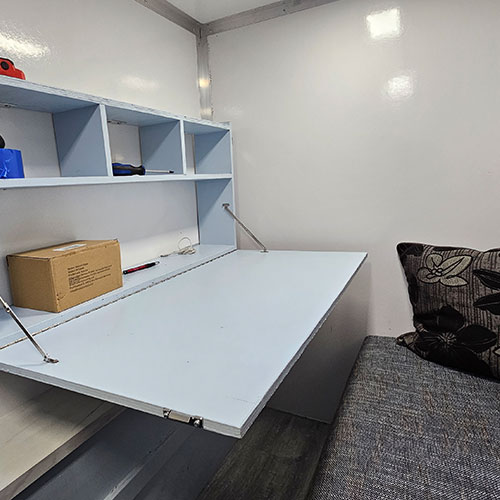 Tiny Tiny Home Prototype interior with desk down